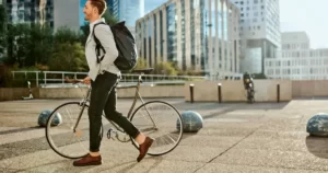 Office man using his bicycle to commute to work.
